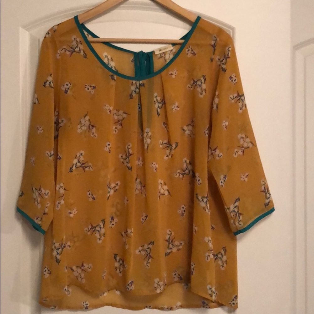Mustard yellow blouse with flowers
